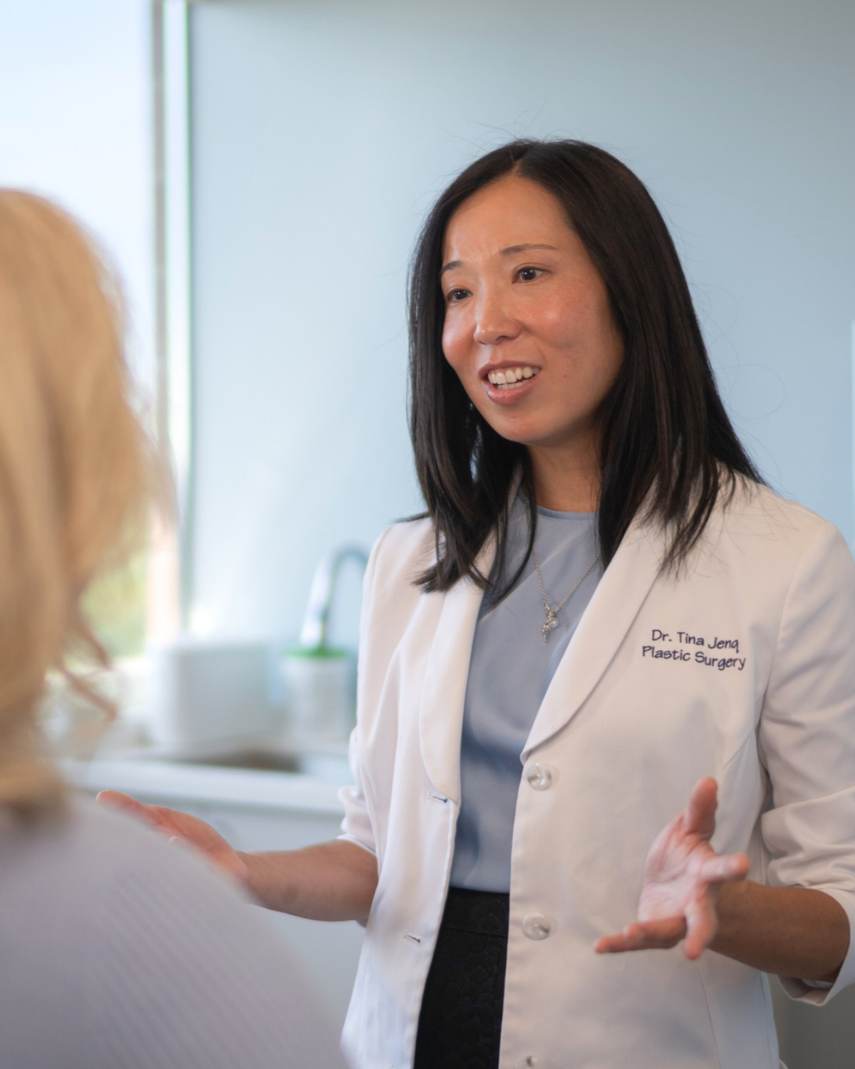 Dr. Tina Jenq talking with a patient in her Happy Valley clinic