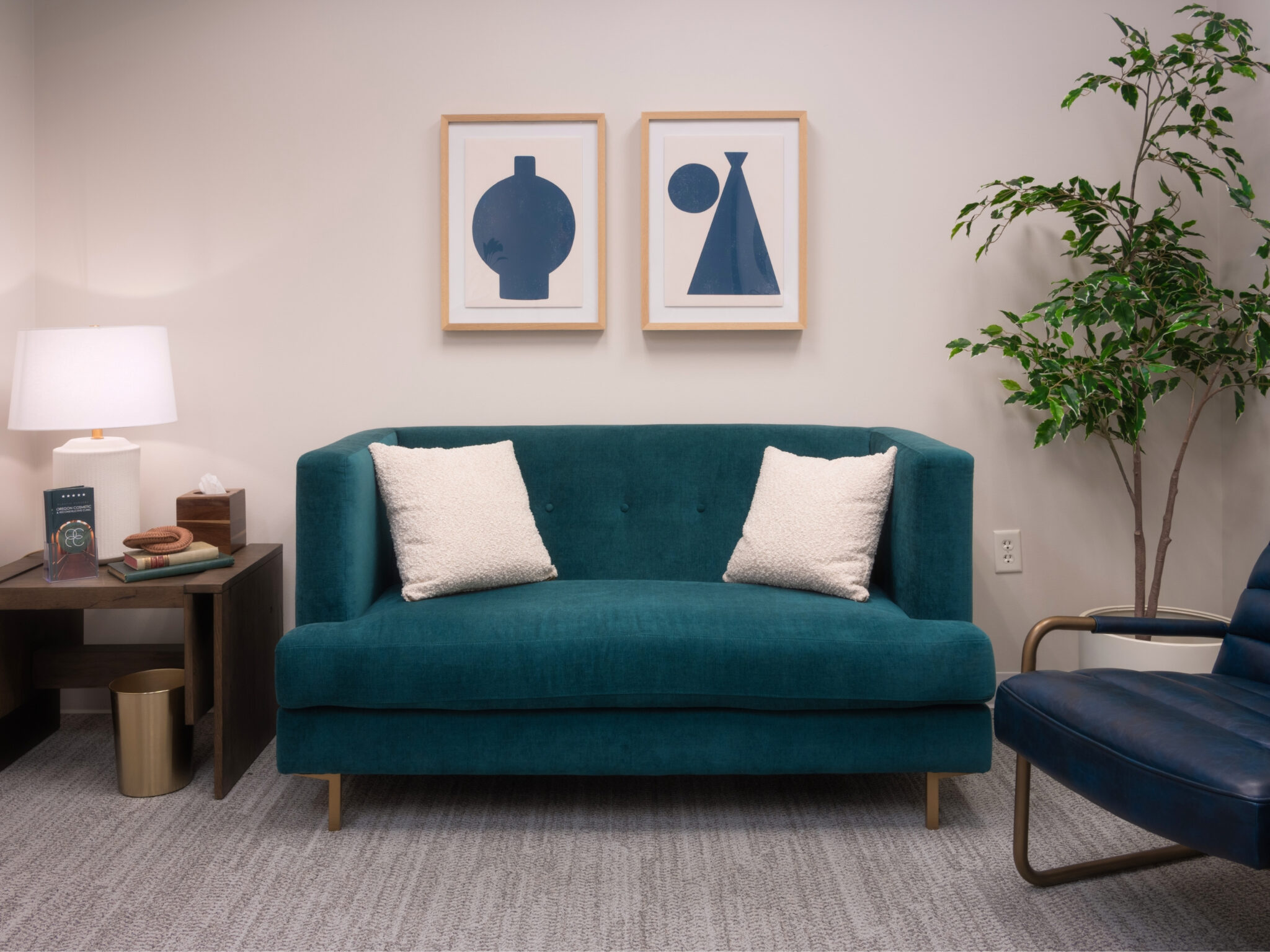 Patient lounge with a teal sofa at Oregon Cosmetic and Reconstructive Clinic